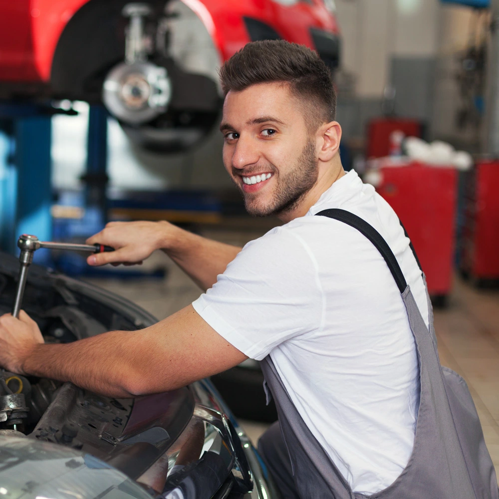 Student working on a car